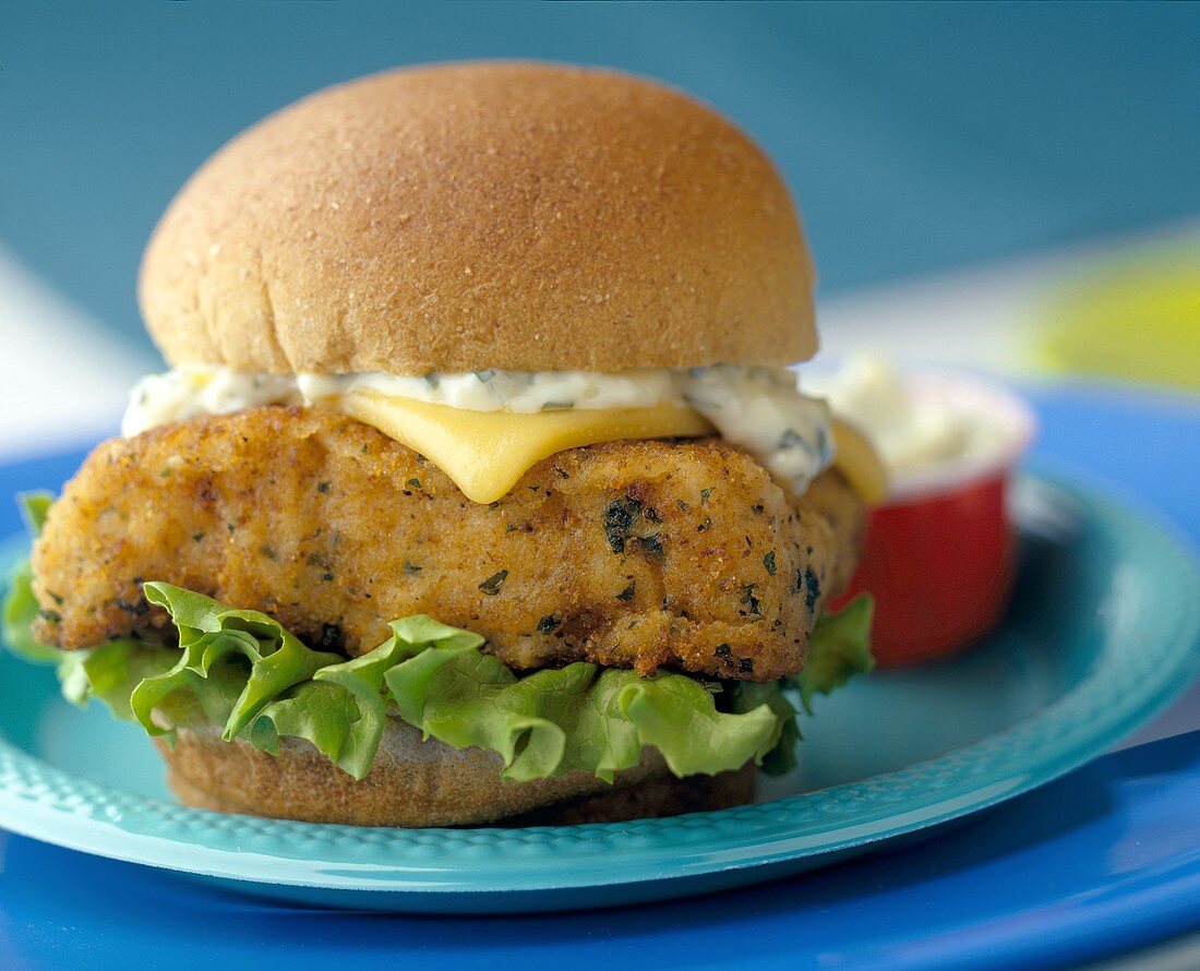 A Fish Fillet Sandwich with Tartar Sauce and Cheese