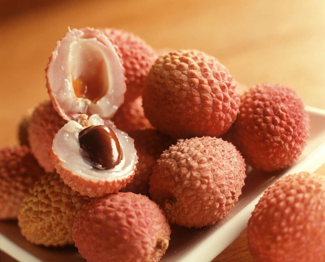 Litchi Fruit on a Plate with One Cut Open