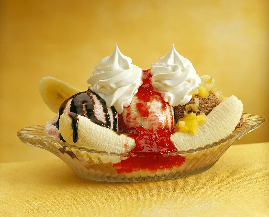 Banana Split in Glass Dish with Strawberry, Vanilla and Chocolate Ice Cream