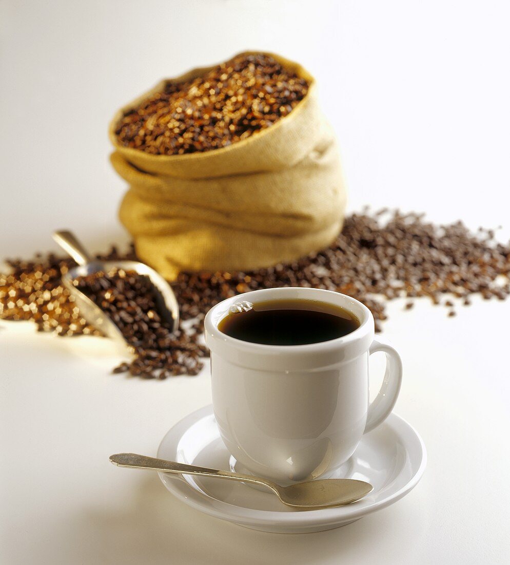 Cup of Coffee with Coffee Beans in Background