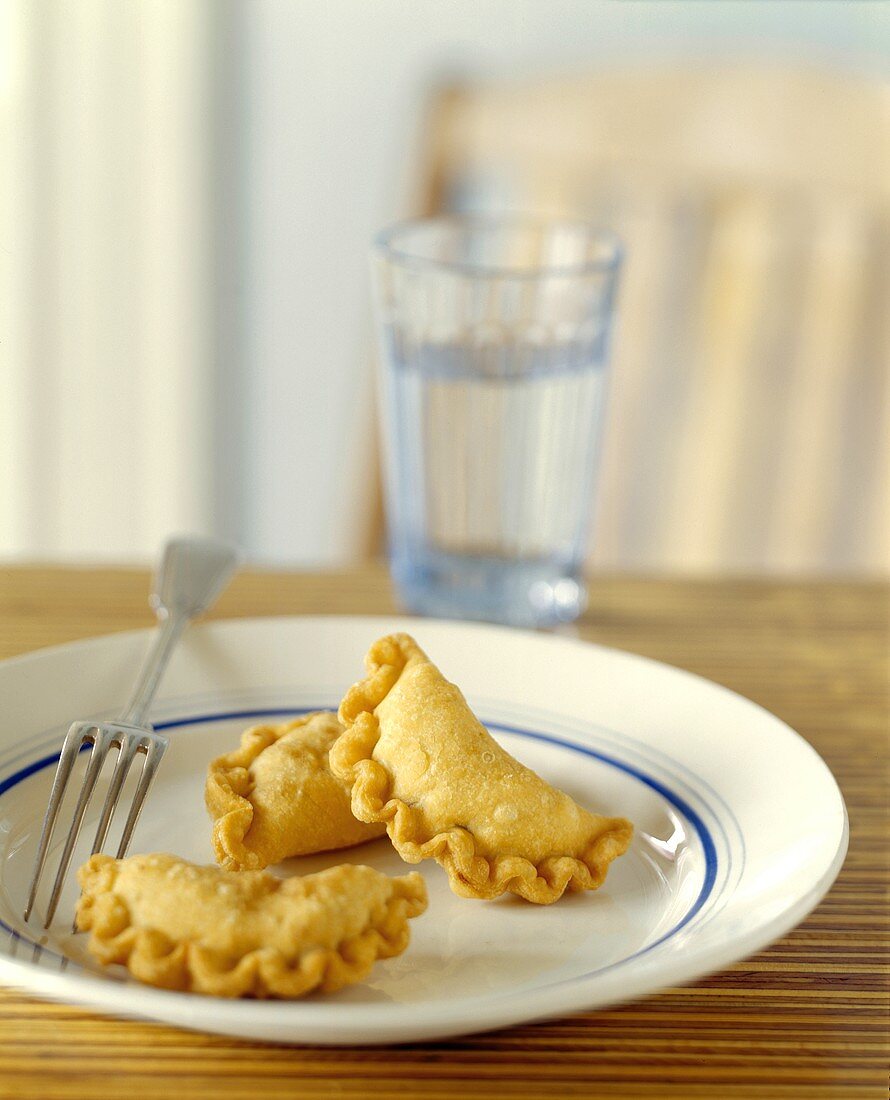 Three Fried Beef Empanadas with Water