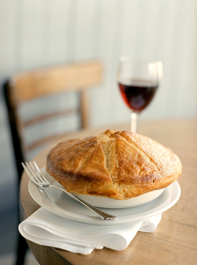 A Pot Pie with a Glass of Red Wine