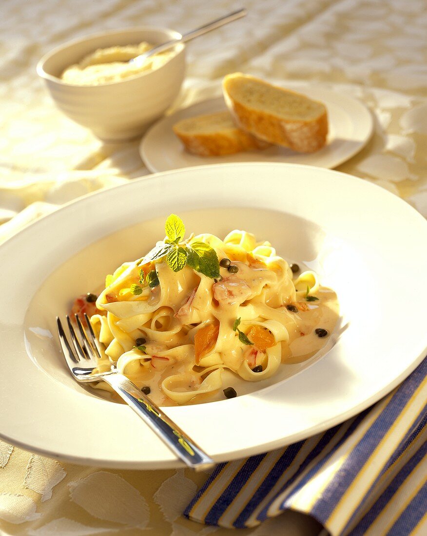 Ribbon pasta with vegetable and cream sauce
