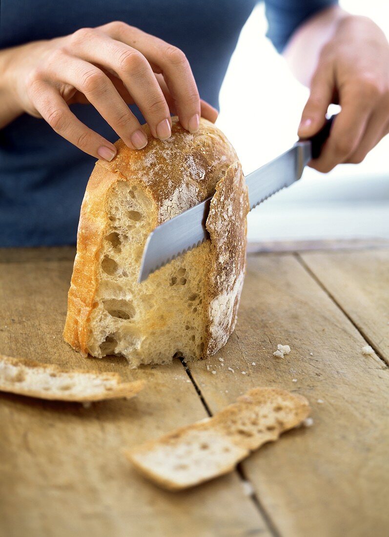 Cutting the crusts off bread