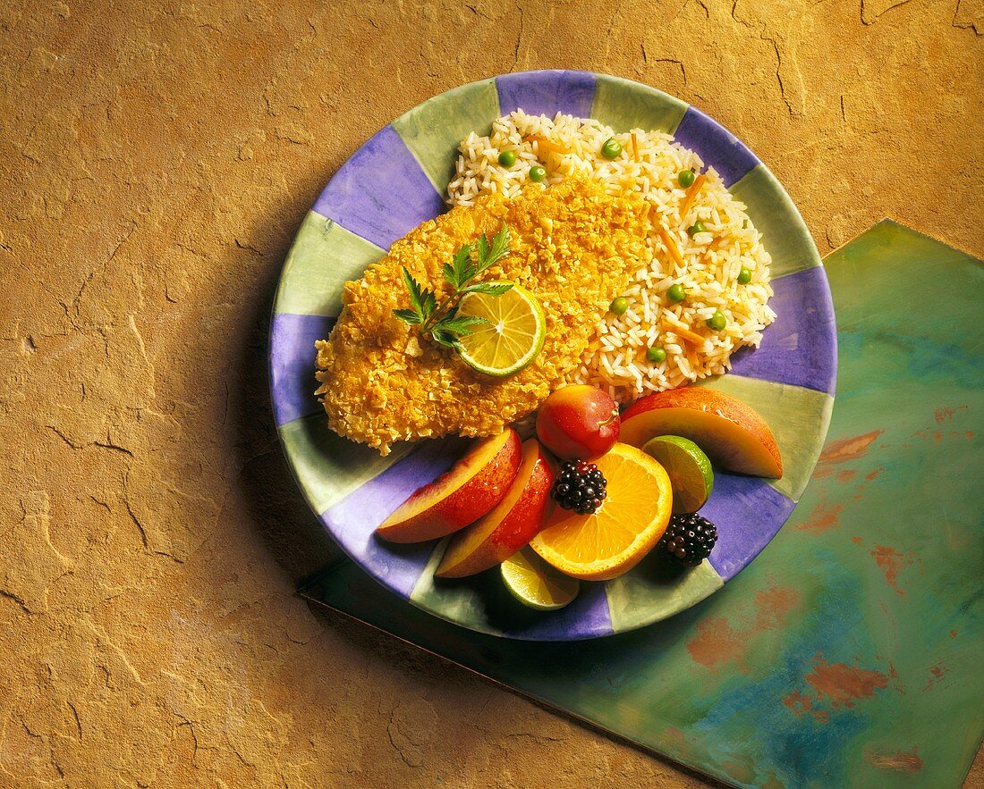 Fried Fish with Rice Pilaf and Sliced Fruit