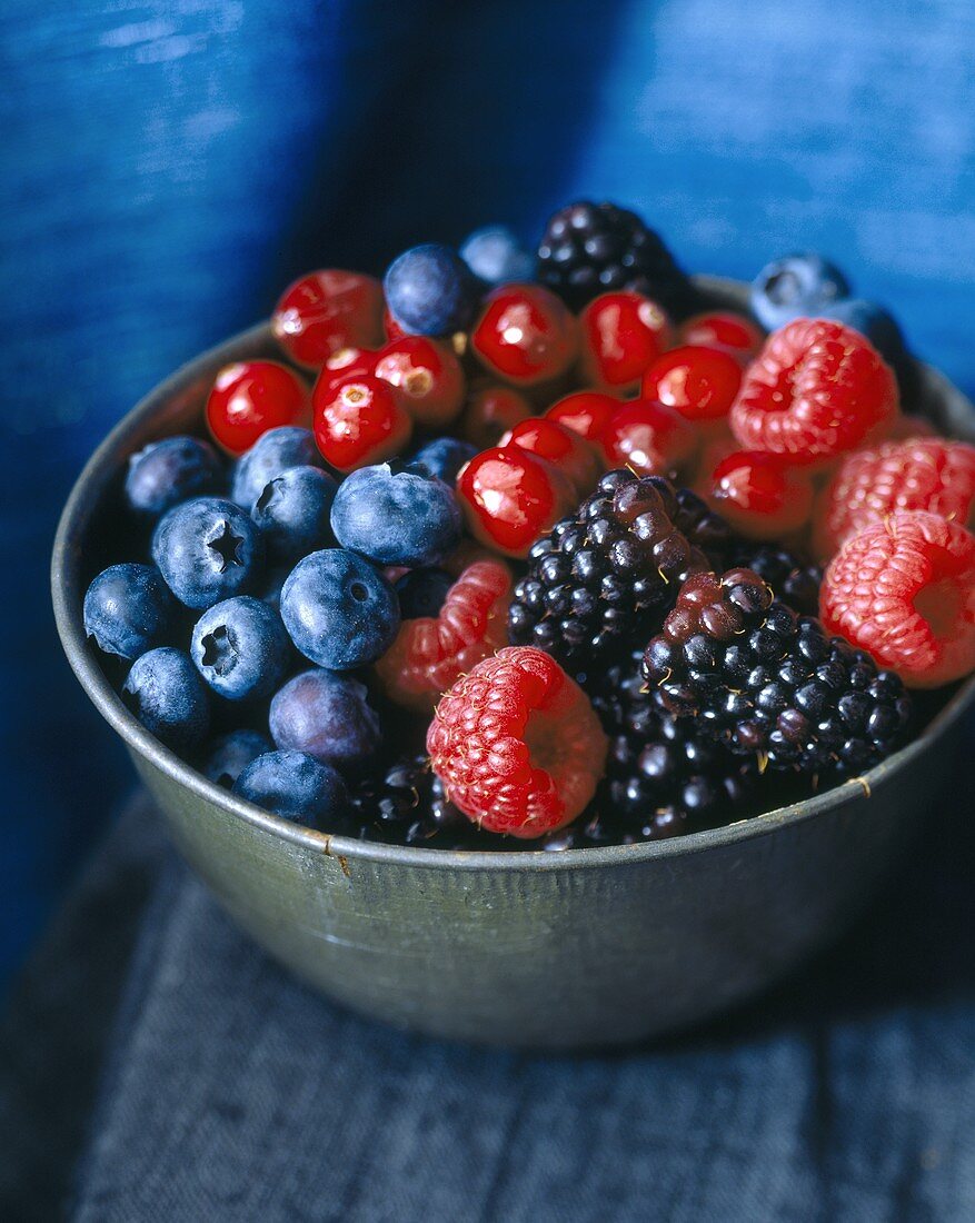 Mixed berries in a metal dish