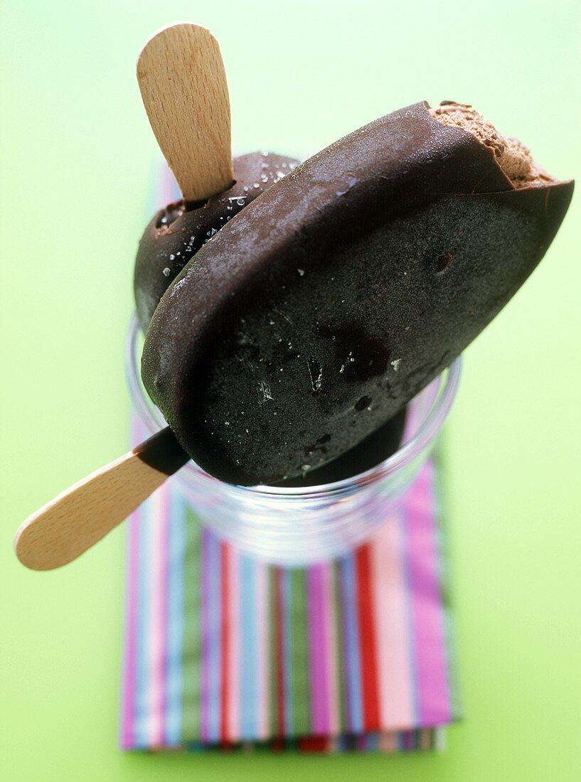 Chocolate-covered chocolate ice cream on stick