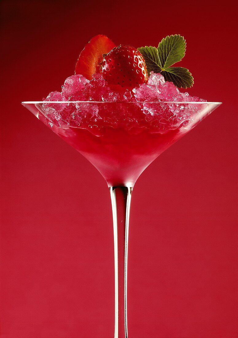 Strawberry Sorbet in a Stem Glass with a Red Background