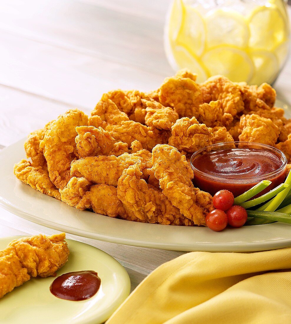 Chicken Tenders (breaded pieces of chicken breast) with dip