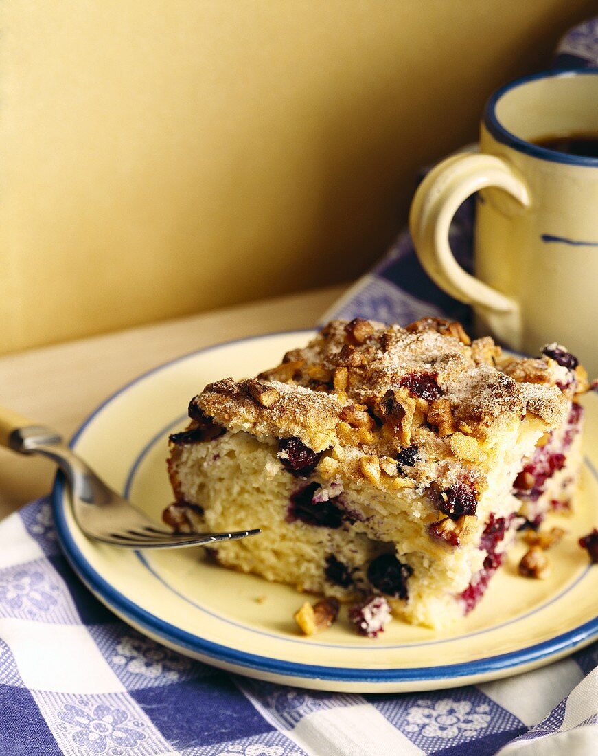 Piece of blueberry cake with walnuts