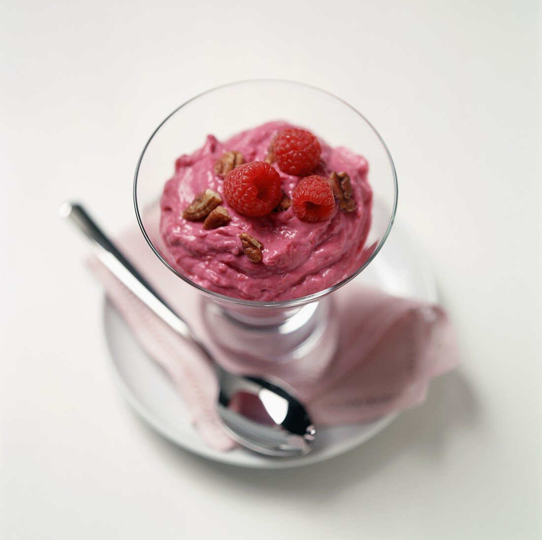 Raspberry Pudding with Walnuts in a Dessert Glass