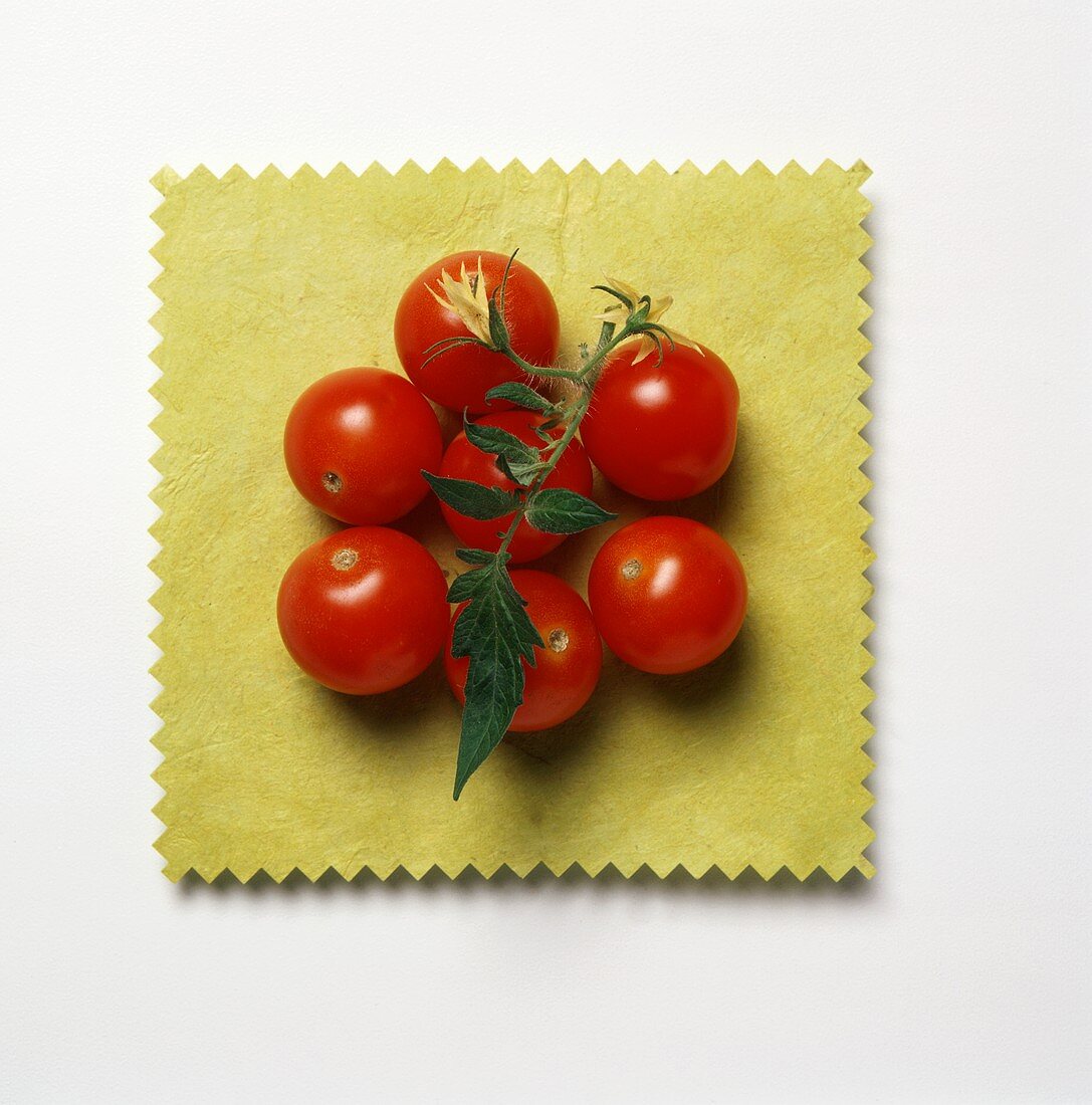 Cherry Tomatoes on a Square Yellow Cloth