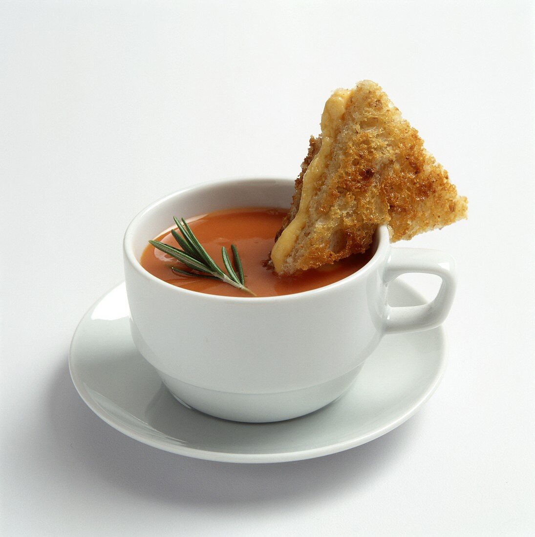 A Cup of Tomato Soup with a Grilled Cheese Triangle