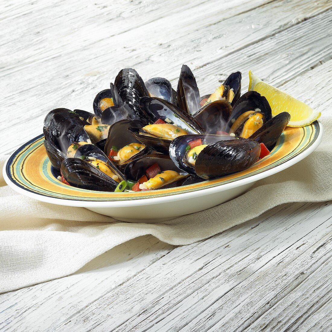 Belgium Mussels in White Wine in a Bowl; Fork