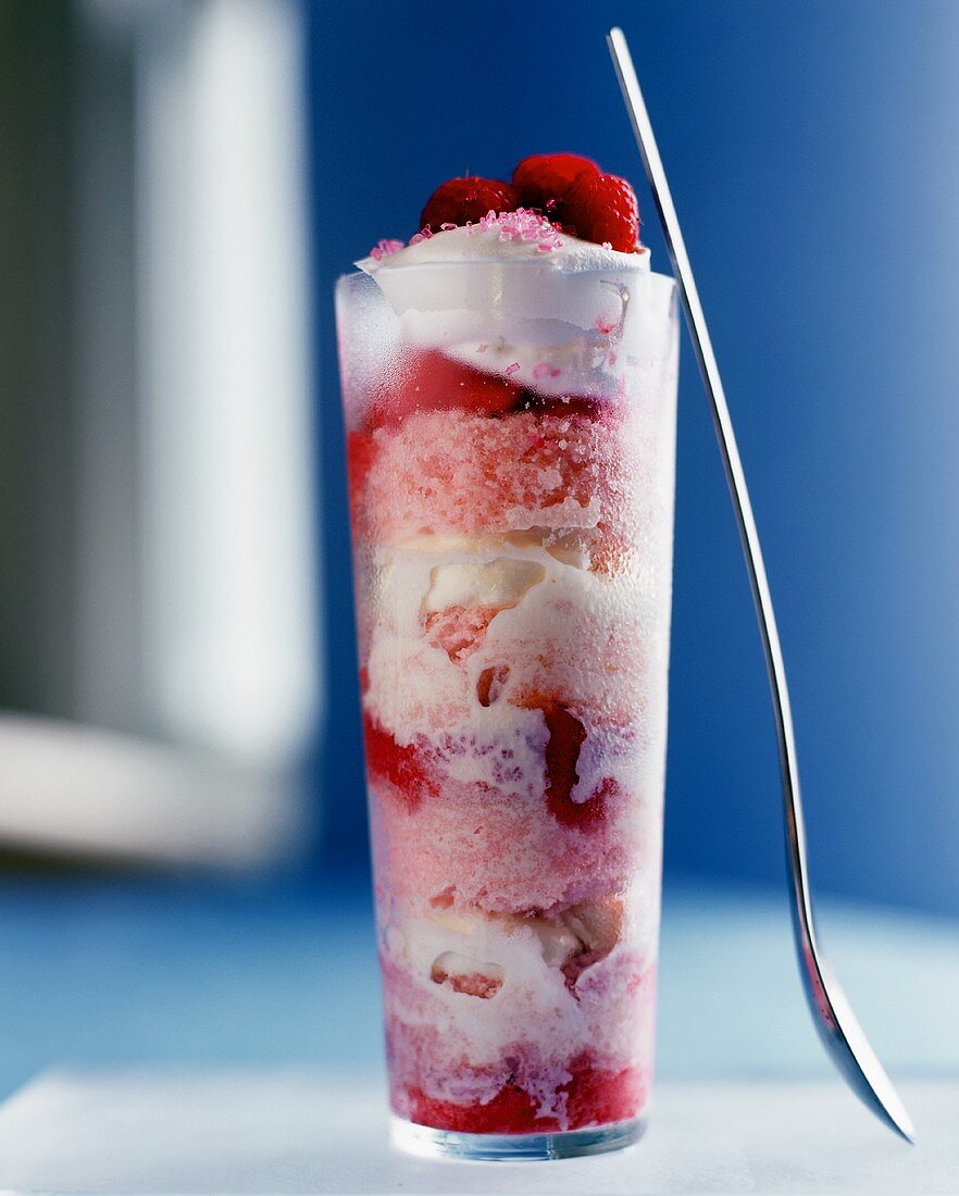 Raspberry parfait with cream in glass
