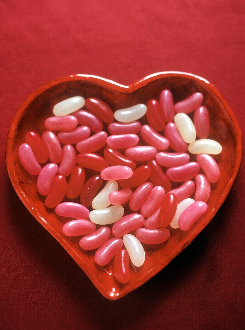 Pink, Red and White Jelly Beans in a Heart Shaped Dish