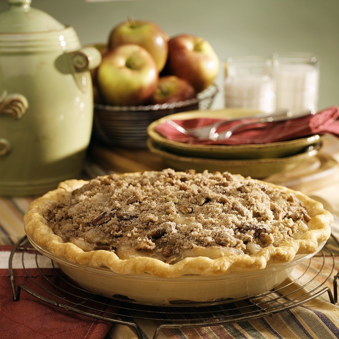 Apple pie in baking dish on cake rack