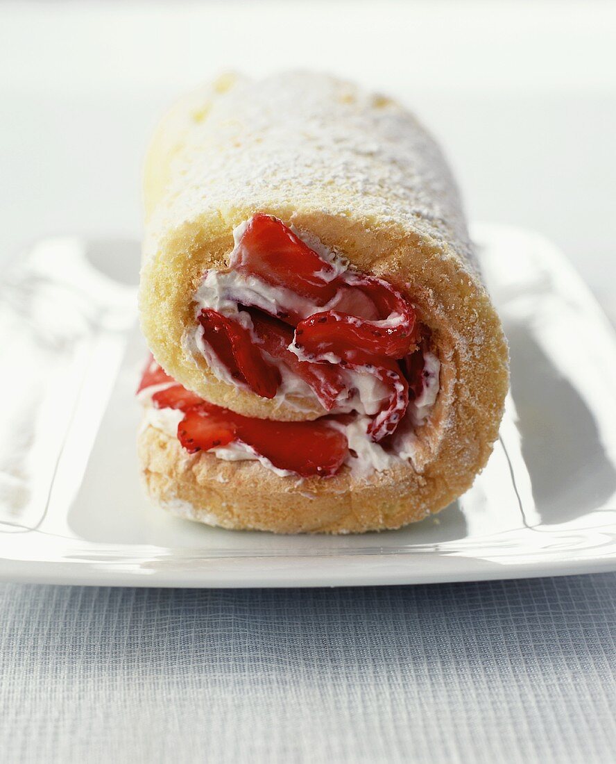 A Rolled Spongecake Filled with Strawberries and Cream