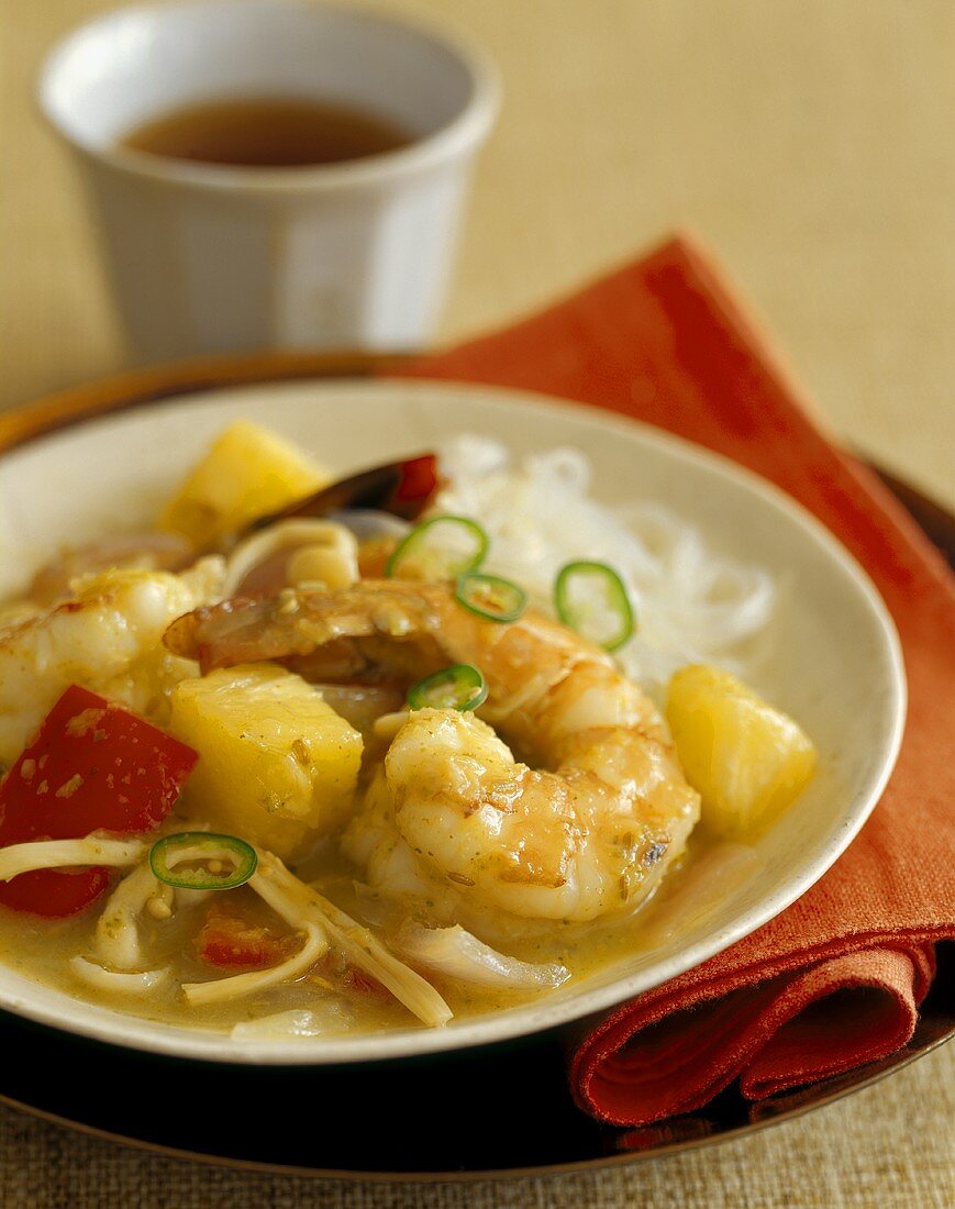 Sweet and sour king prawns with pineapple and peppers