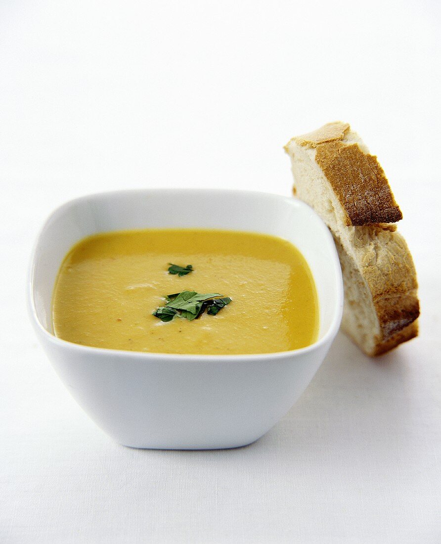 Apple and Parsnip Soup in a Square Bowl with Bread Slice