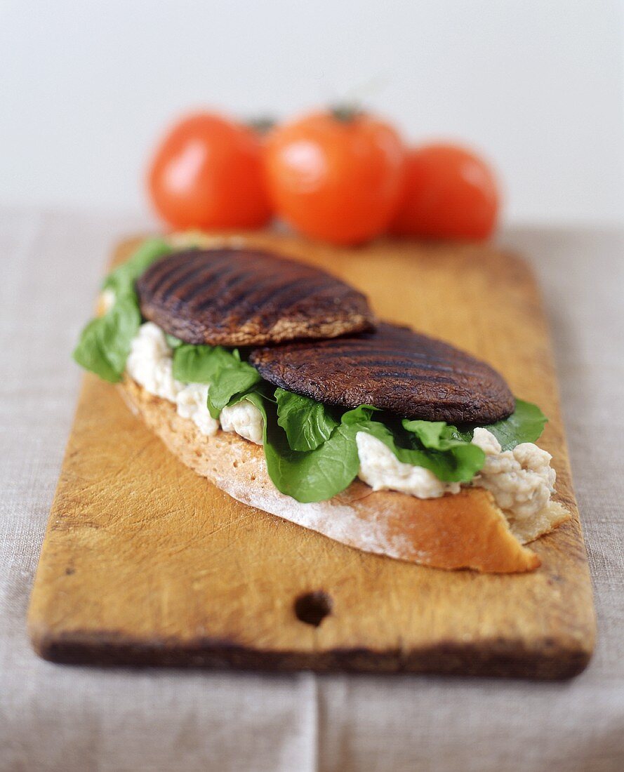 Open sandwich on chopping board