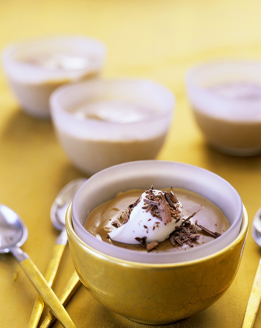 Chocolate mousse with cream and chocolate curls