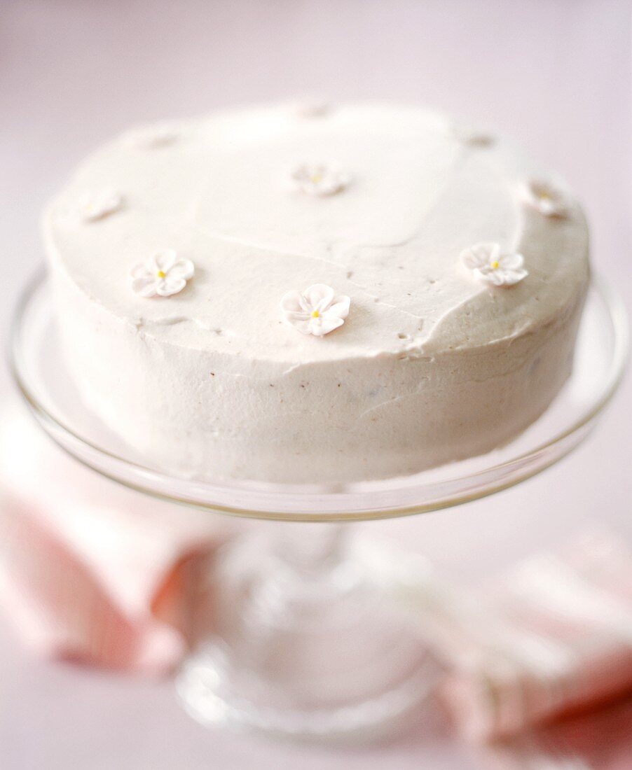 White celebration cake with sugar flowers