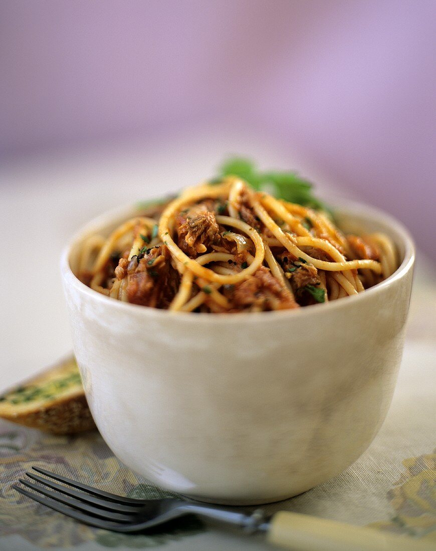 A Bowl of Spaghetti in a Spicy Tomato Sauce with Pork