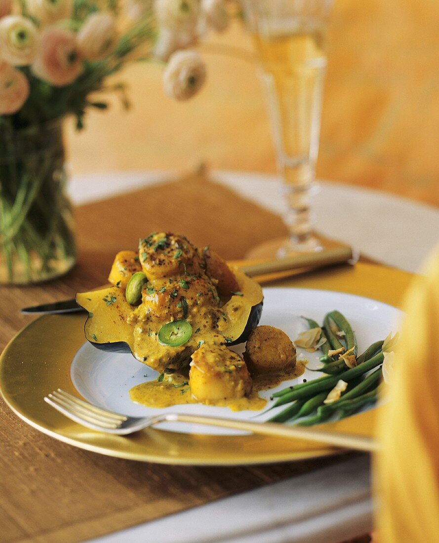 Cooked Acorn Squash Topped with Curried Scallops