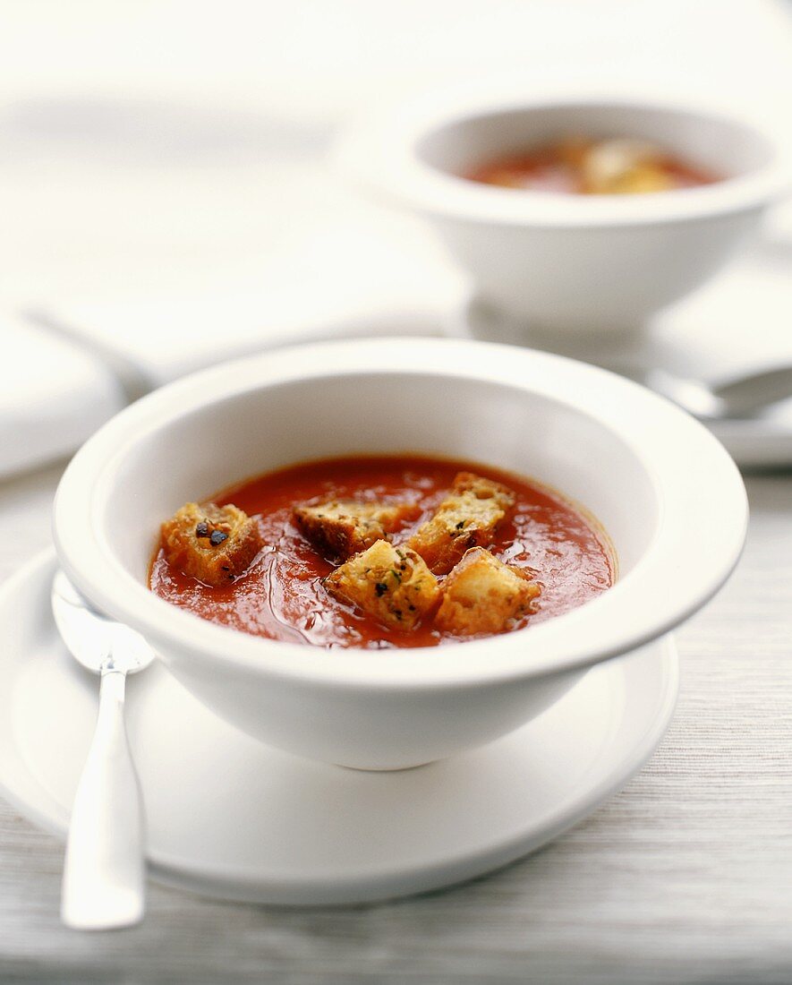 A Bowl of Tomato Soup with Parmesan Croutons