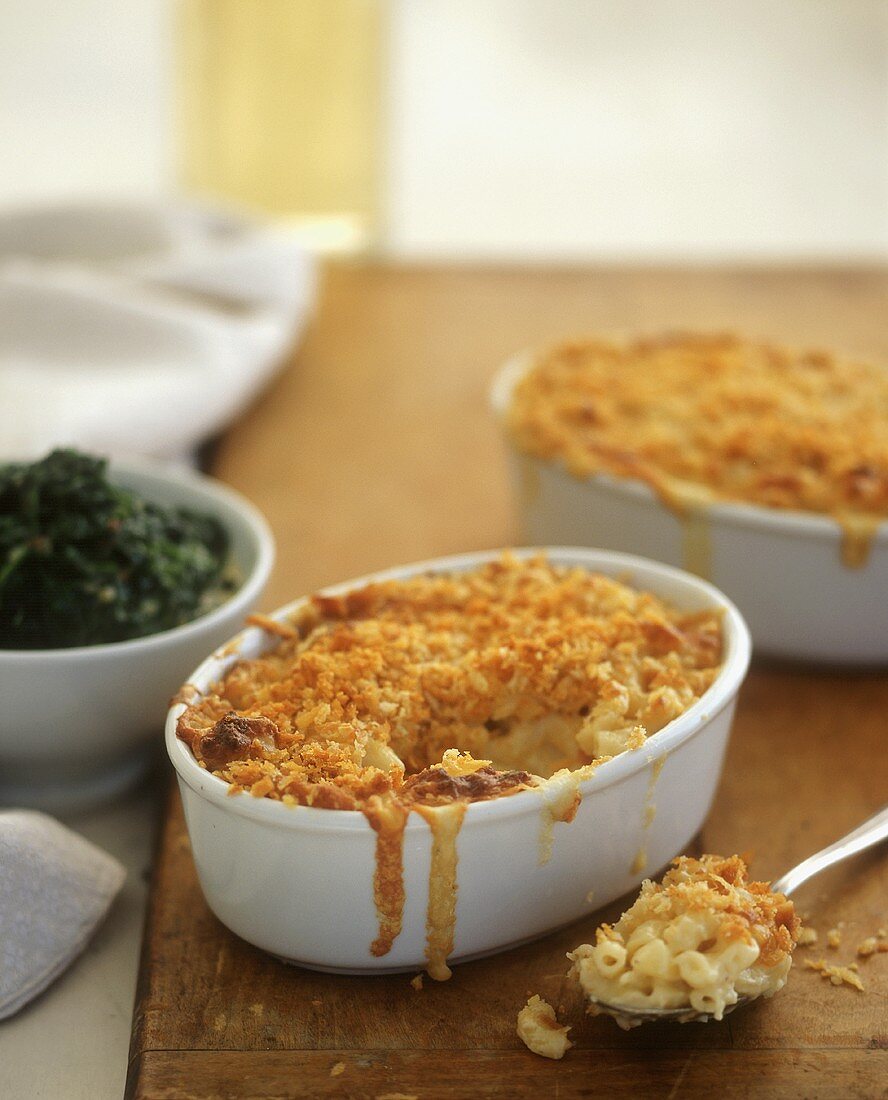 Macaroni and Cheese with Crunchy Topping in a Small Baking Dish and on a Spoon