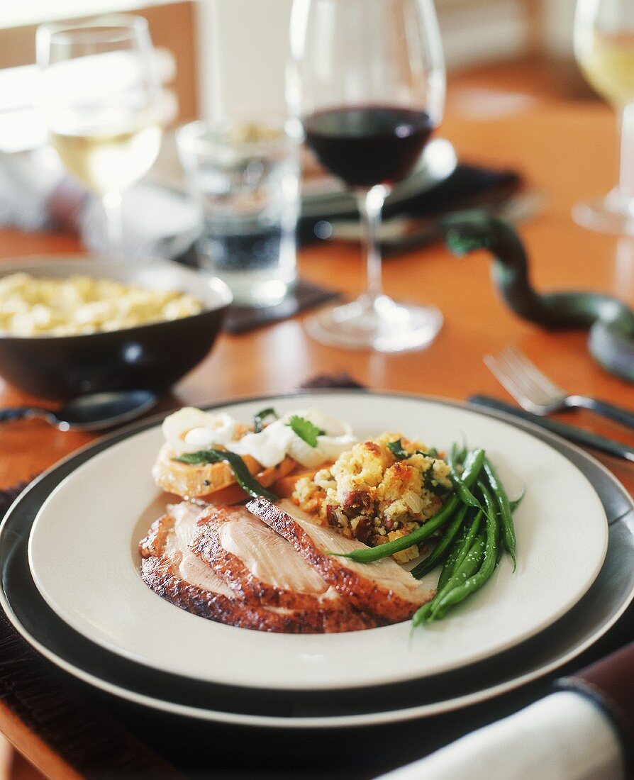 Slices of Roast Turkey with Green Beans and Stuffing