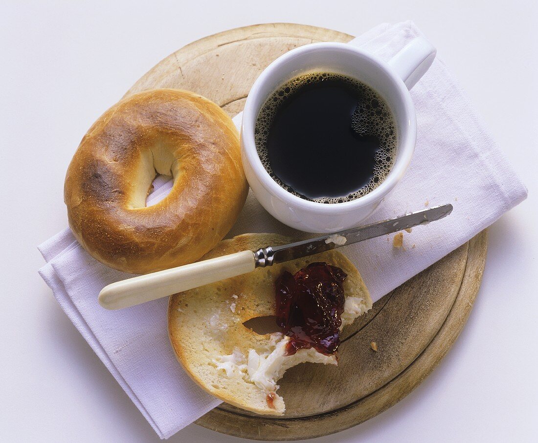 A Bagel with Butter and Jelly and a Cup of Coffee