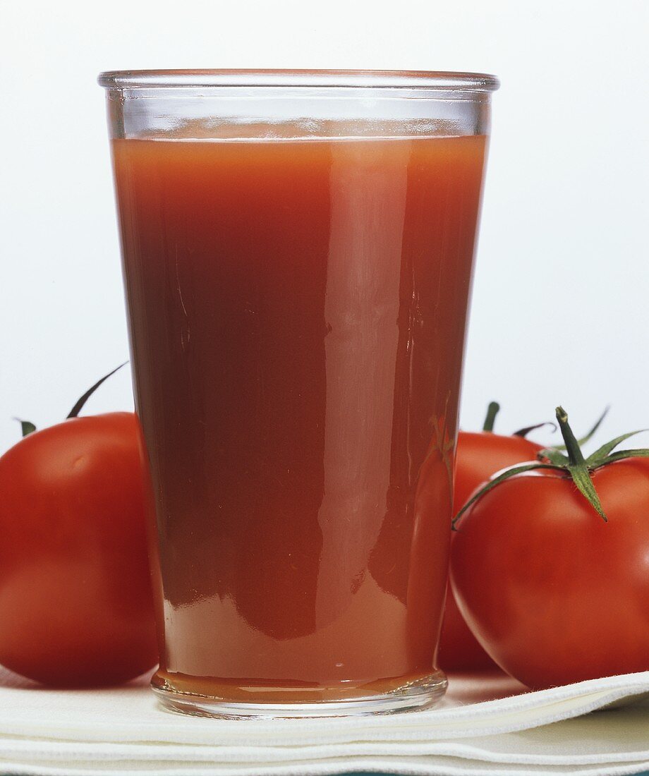 A Glass of Tomato Juice with Tomatoes