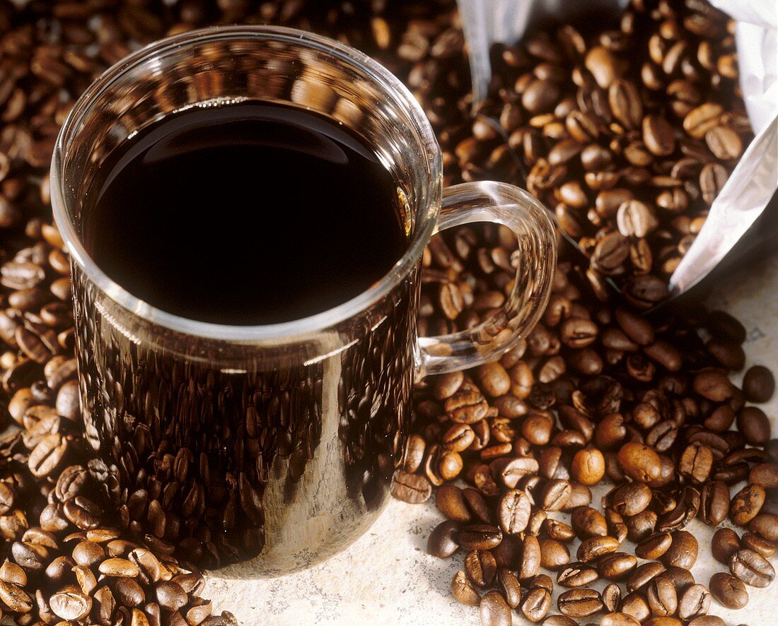 A Cup of Coffee with Coffee Beans