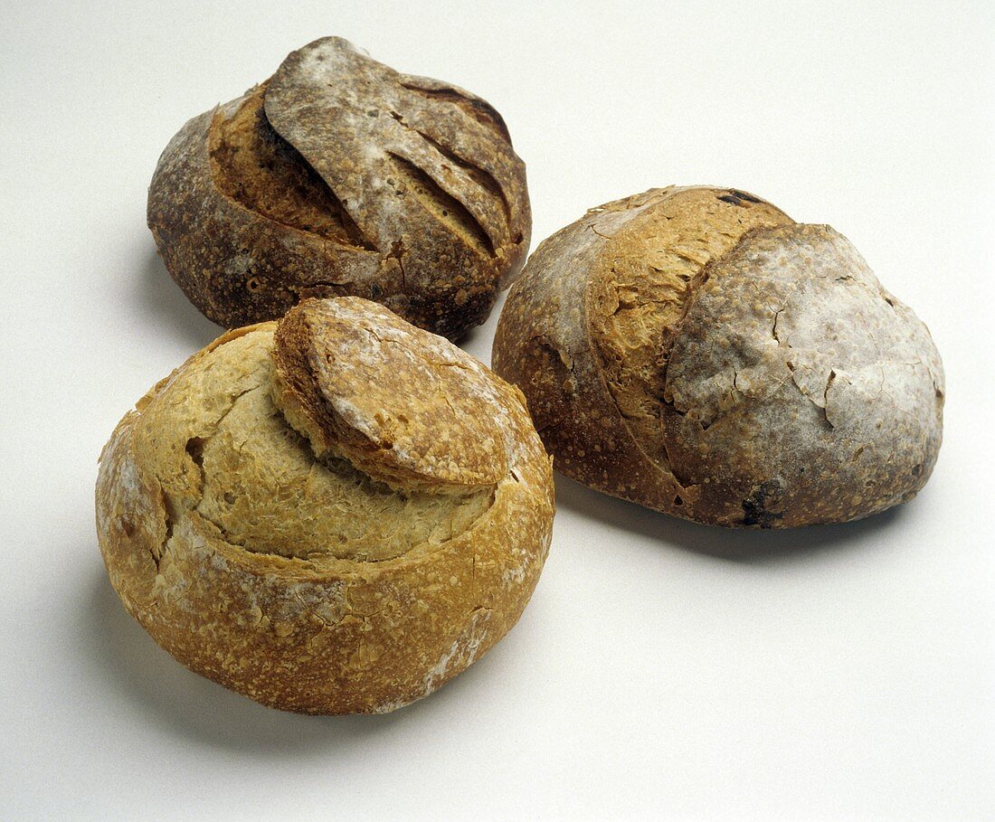 Three Round Loaves of Crusty Bread