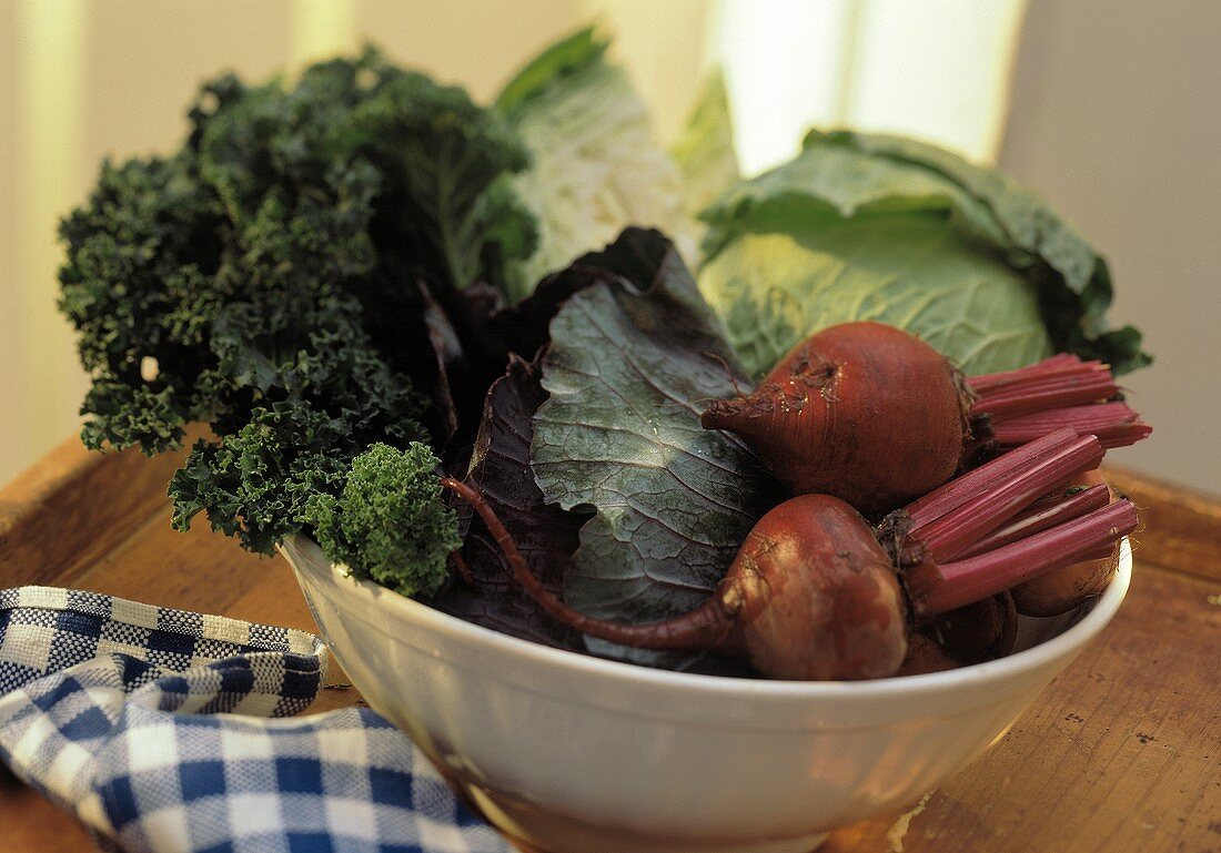 Assorted Leaf Vegetables and Red Beets in a Bowl
