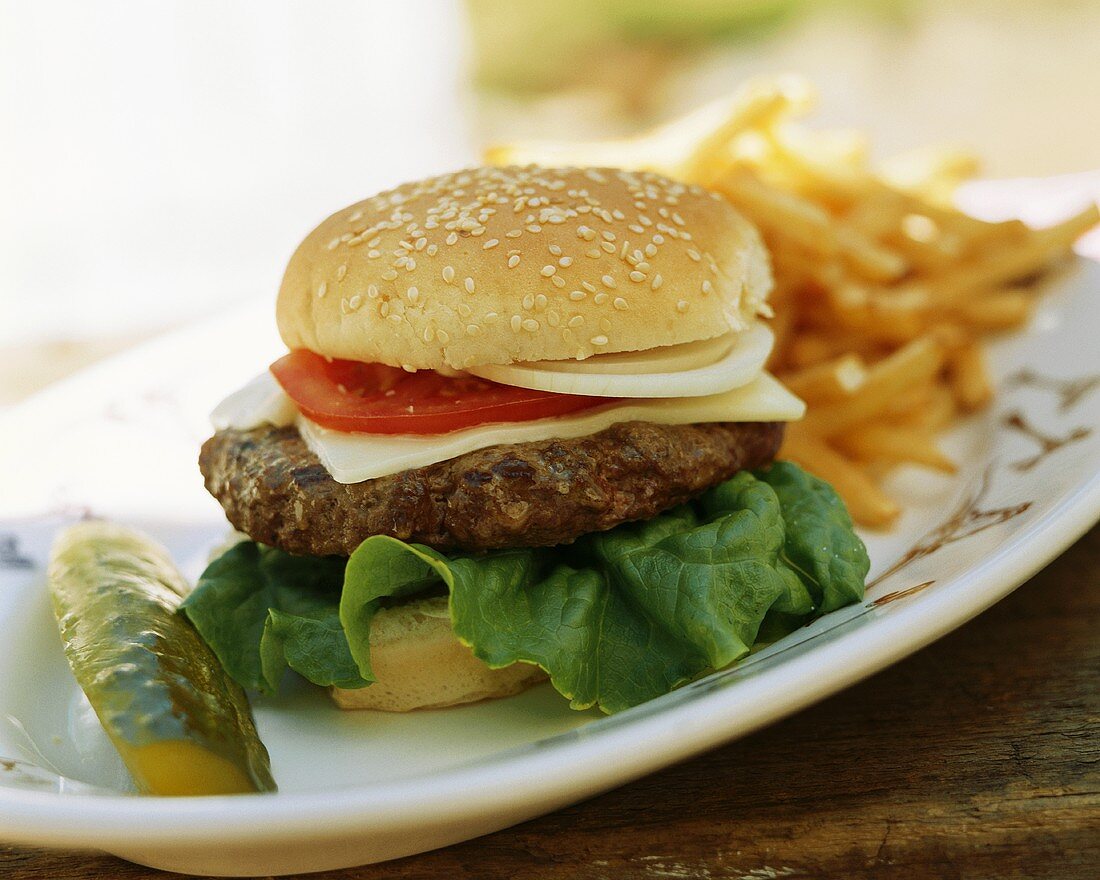 Cheeseburger and a Pickle on a Table Outside