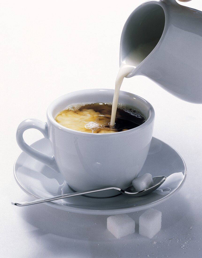 Cream Pouring into Coffee