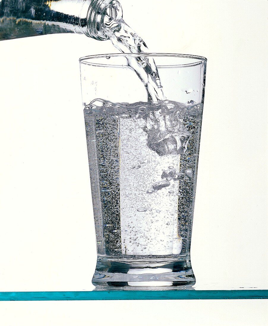 Seltzer Water Pouring into a Glass