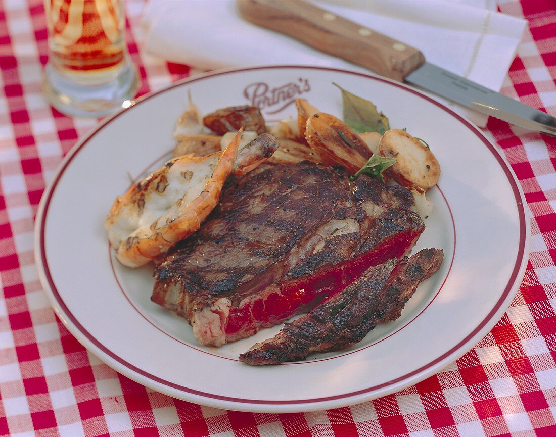 Steak Sliced on a Plate with Shrimp
