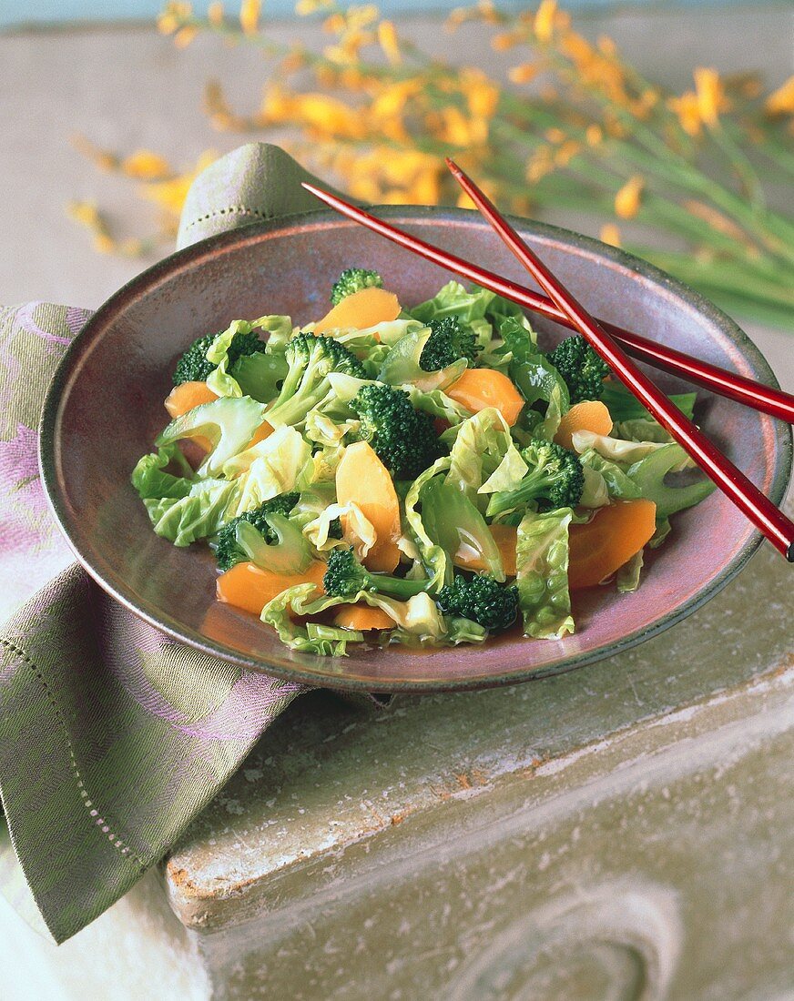 A Bowl of Salad with Chopsticks