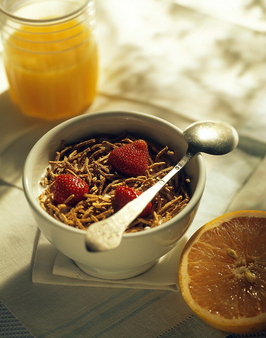 A Bowl of Bran Cereal with Strawberries