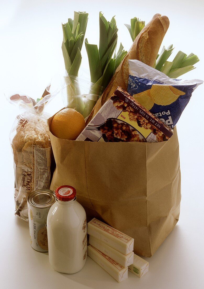 Fresh Produce in and Beside a Brown Paper Bag