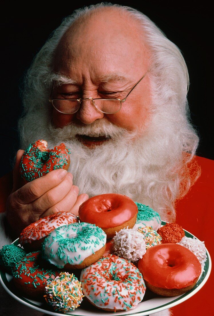 Weihnachtsmann mit Donuts