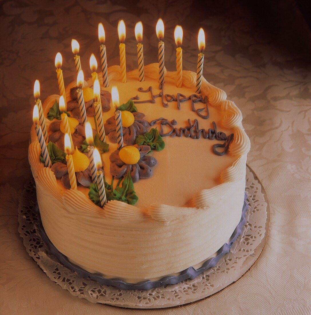Birthday Cake with Many lit Candles