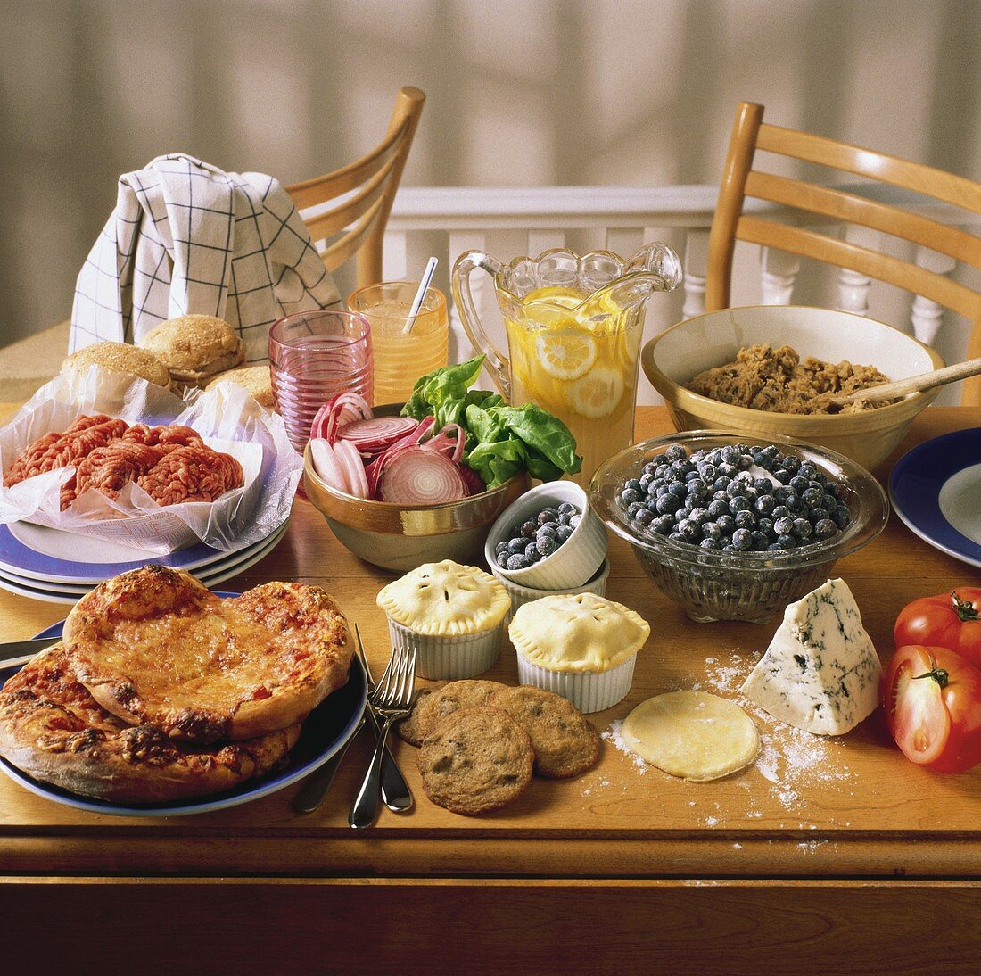 Assorted Prepared and Unprepared Foods on a Table