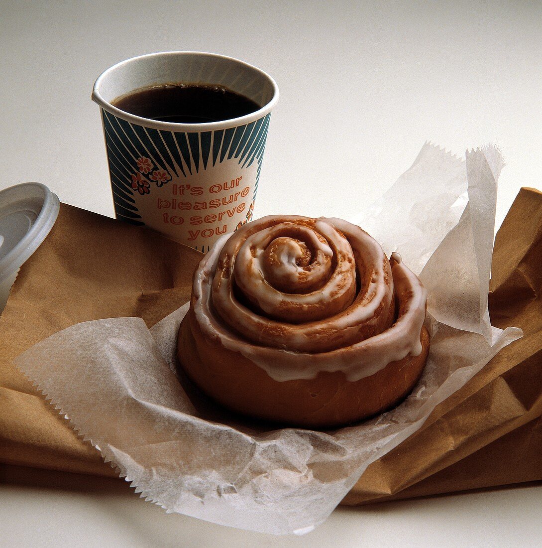 Cinnamon Bun with a Cup of Coffee