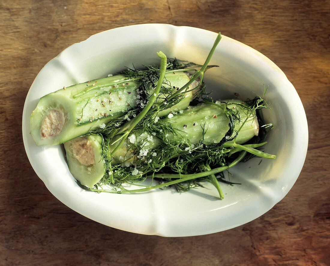 Two Stuffed Cucumbers in a Bowl; Dill