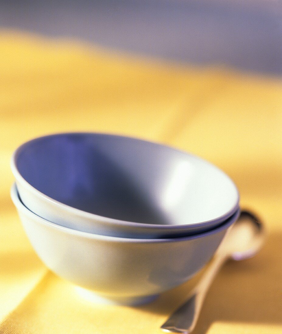 Empty Blue Bowls on a Yellow Cloth
